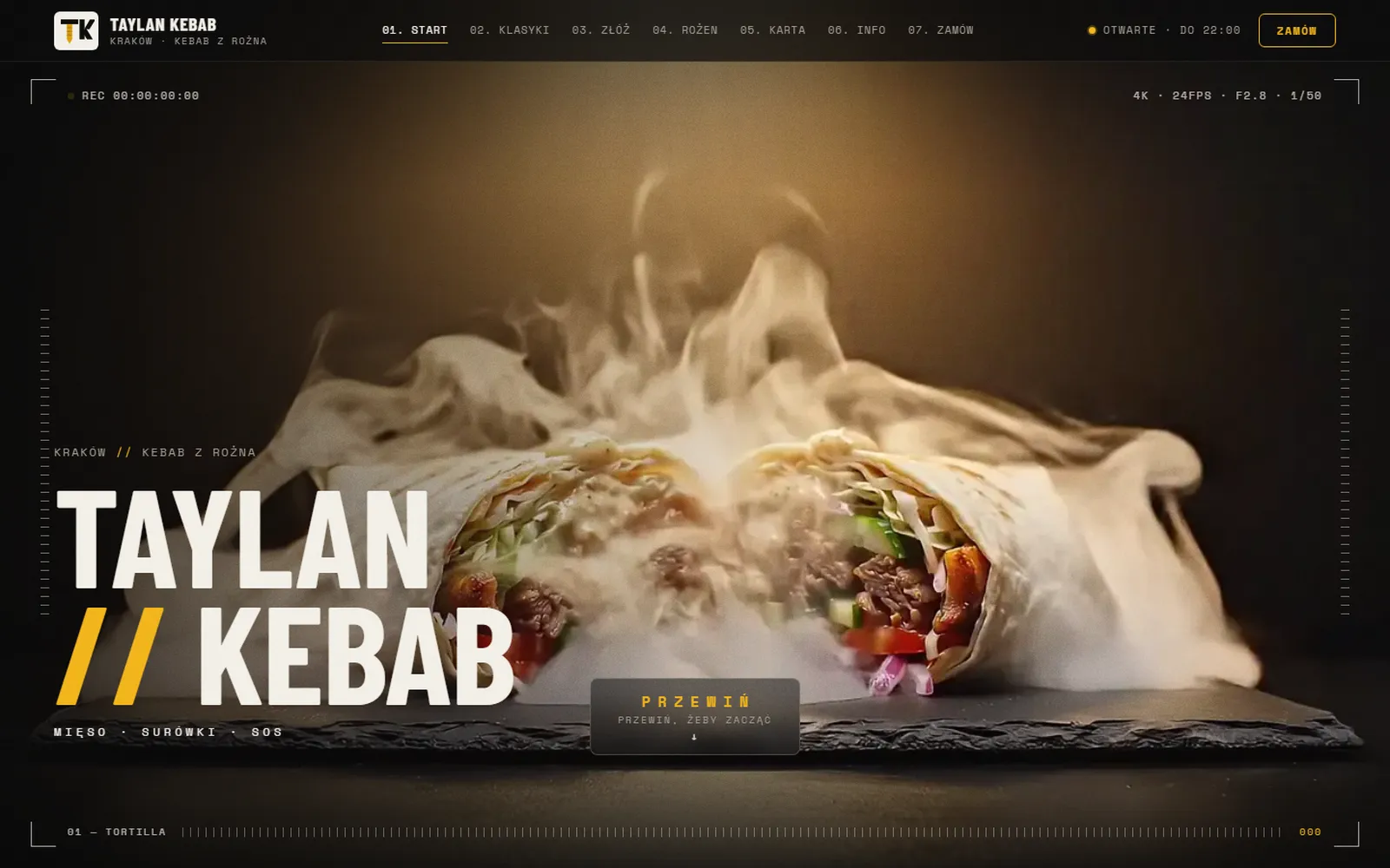 Taylan Kebab — strona kebabu: dymiący kebab w tortilli na ciemnym tle